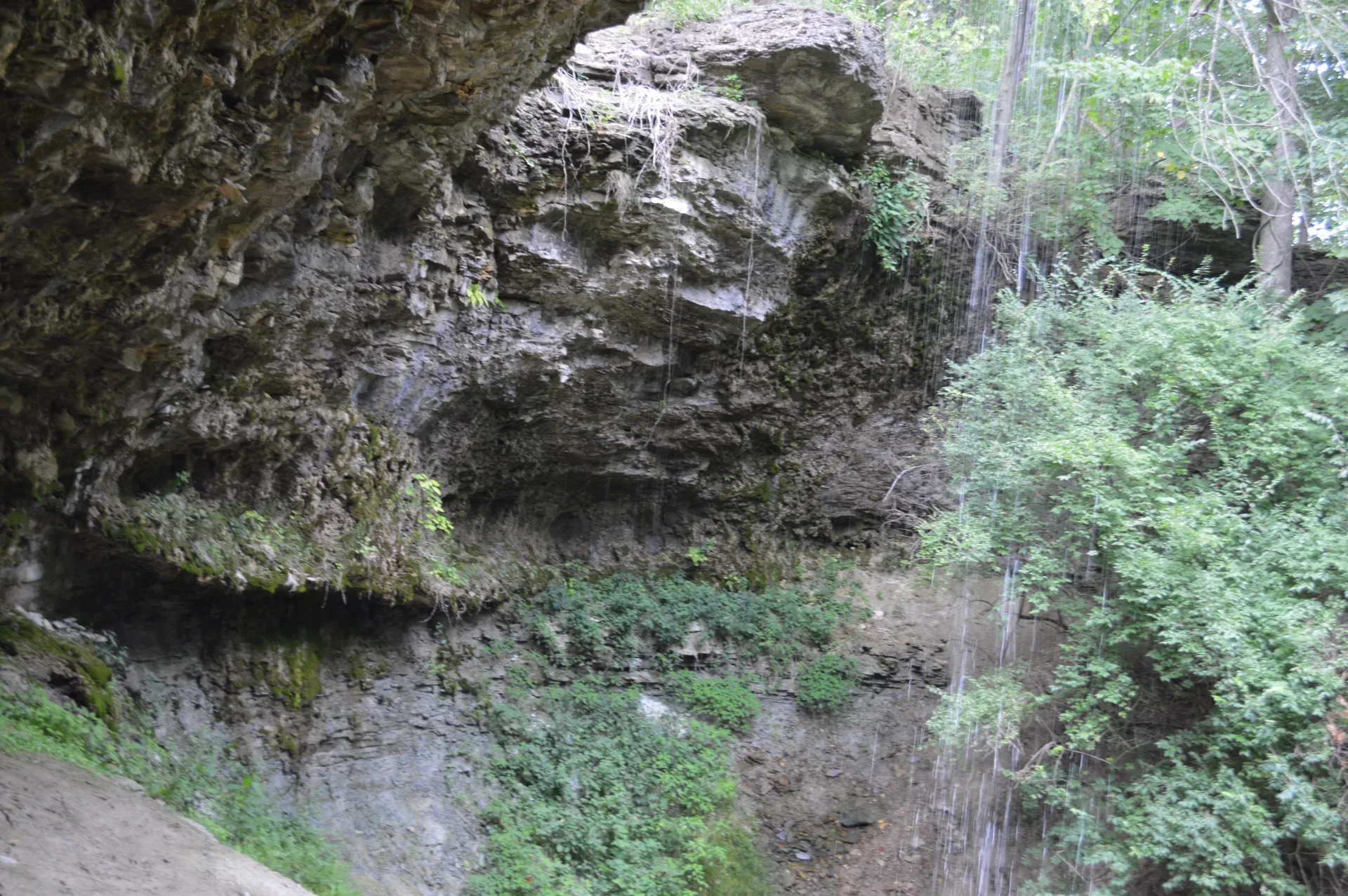 A wooded ravine and waterfall at Vandalia Falls park in Vandalia, Ohio